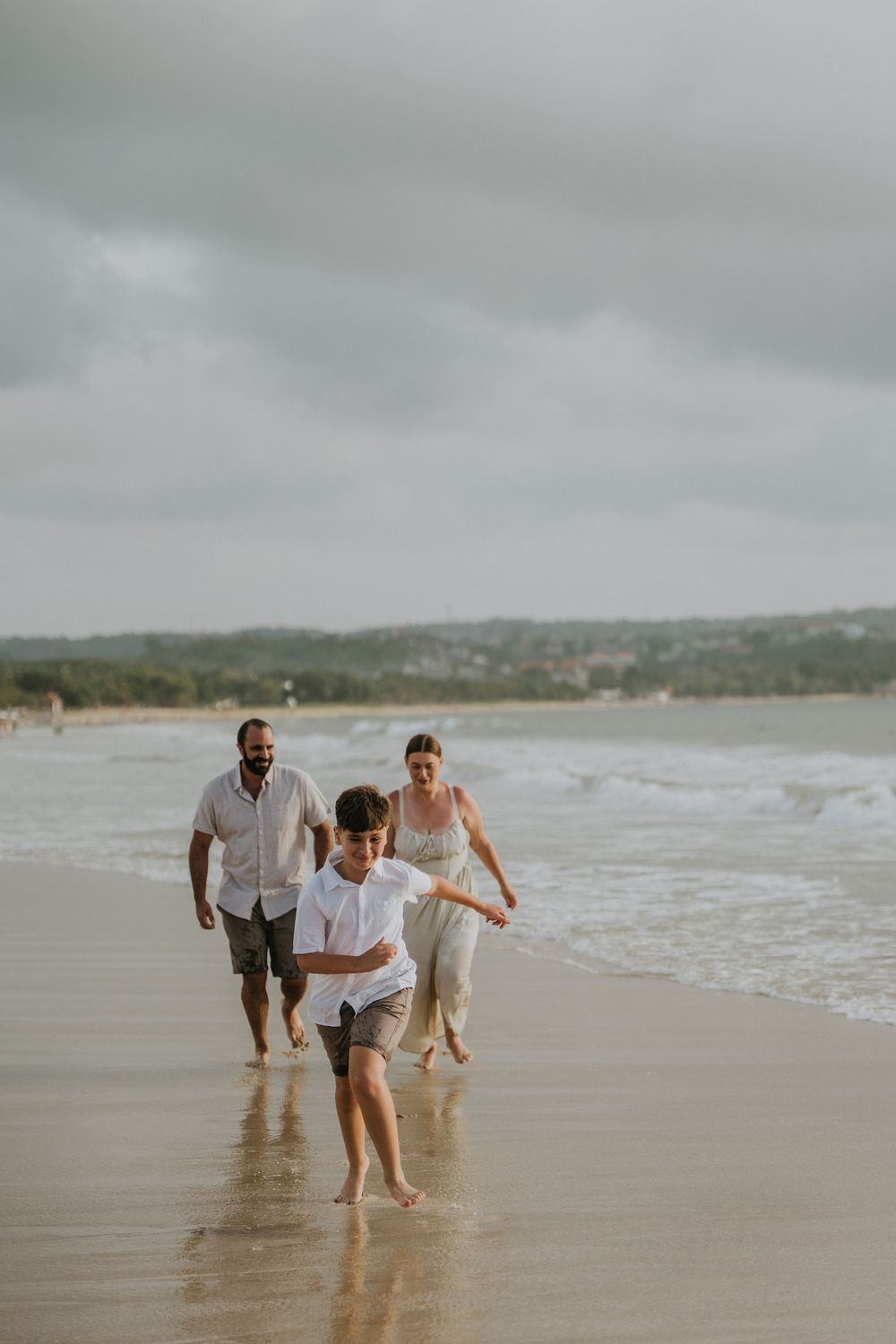 Professional family photography services in Bali at Jimbaran Beach.