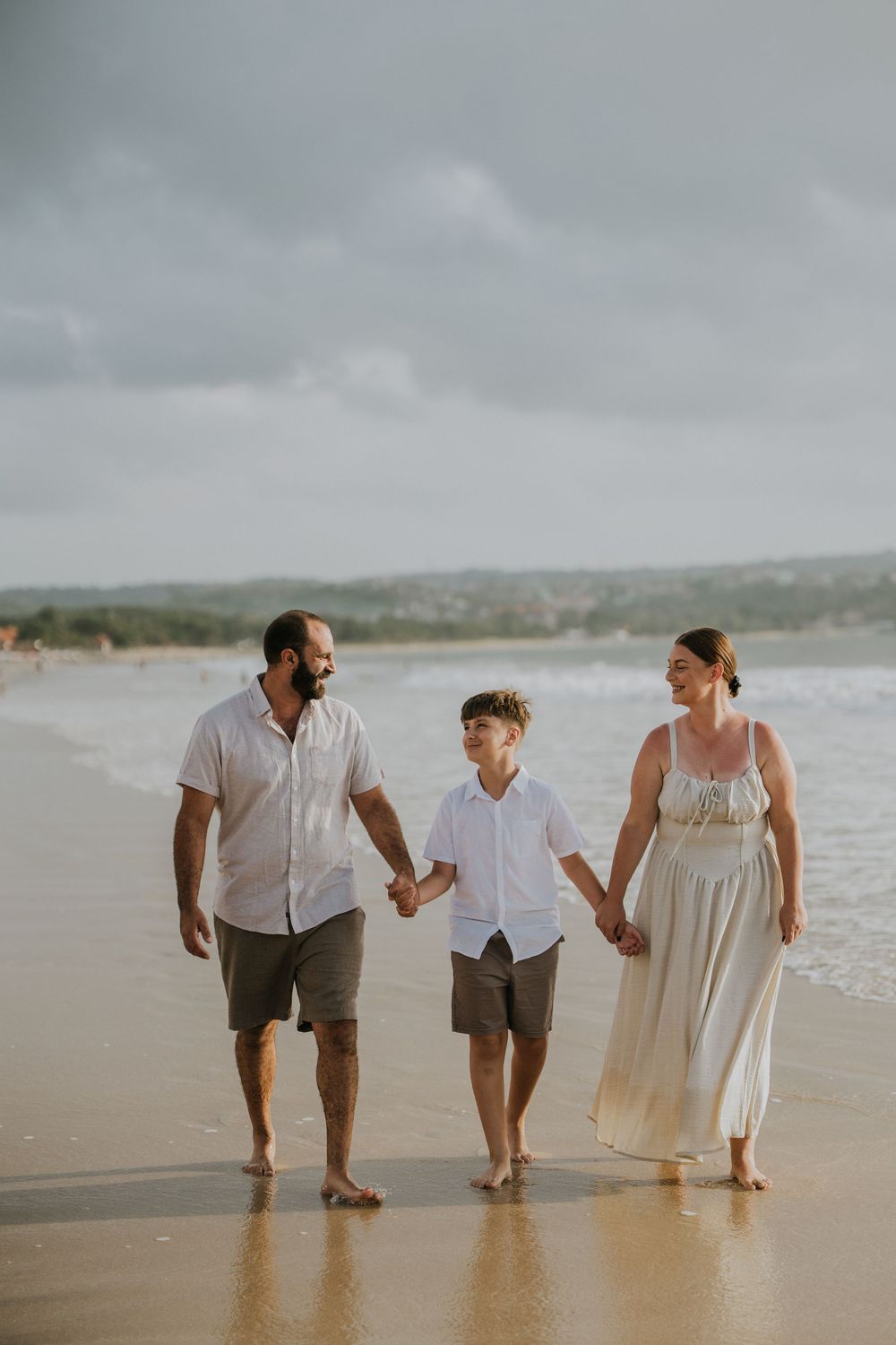 Professional family photography services in Bali at Jimbaran Beach.