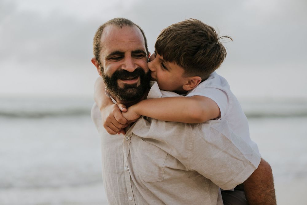 Professional family photography services in Bali at Jimbaran Beach.