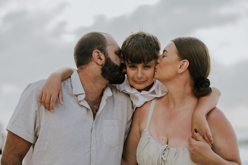 Professional family photography services in Bali at Jimbaran Beach.