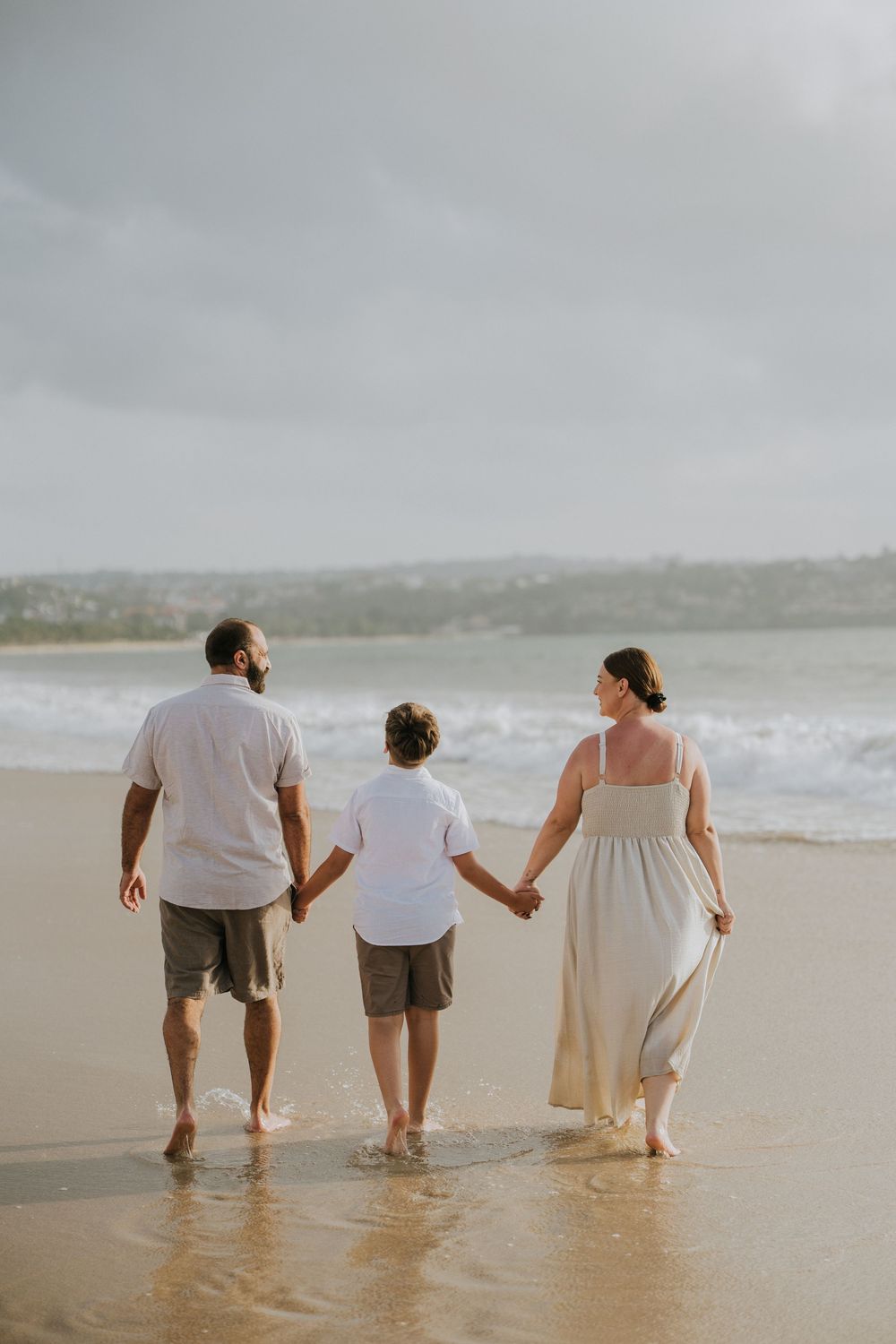 Professional family photography services in Bali at Jimbaran Beach.