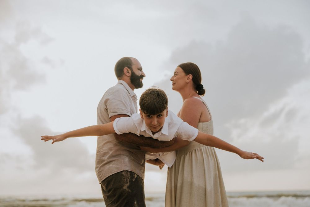 Professional family photography services in Bali at Jimbaran Beach.