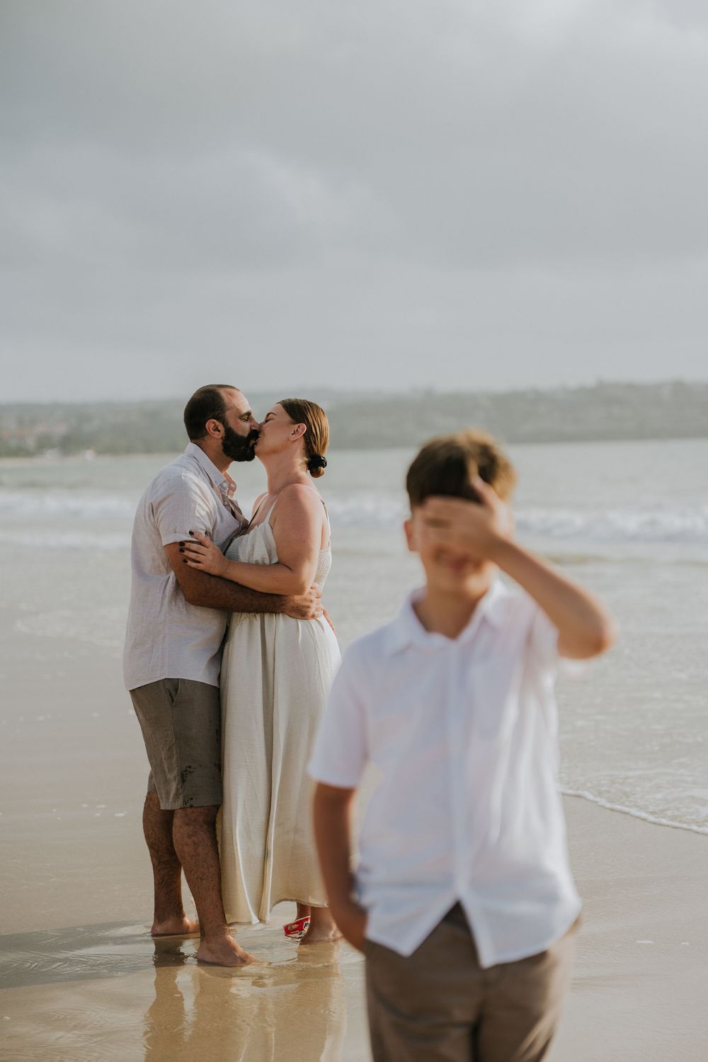 Professional family photography services in Bali at Jimbaran Beach.