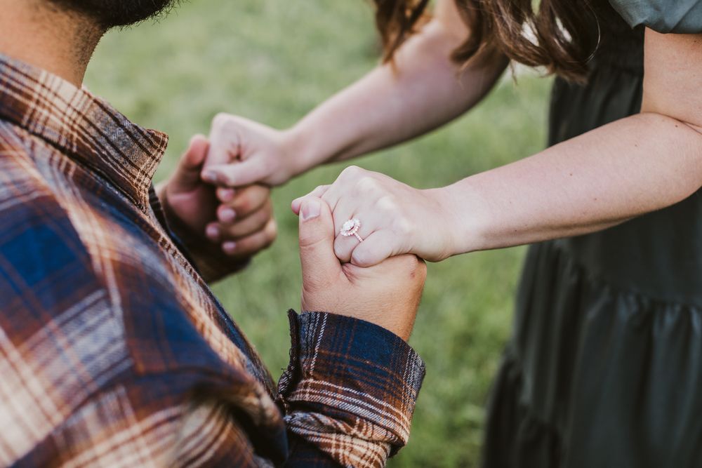 An above view of man and woman holding hands after engagement in Concord, MA. Seacoast, North Conway, Lincoln NH engagement photographer