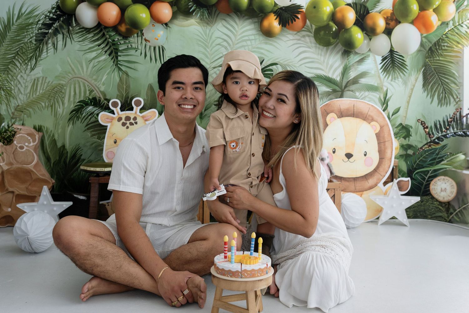 A series of tropical-themed photos with cake, decorations, and palm leaves in a warm, celebratory setting.