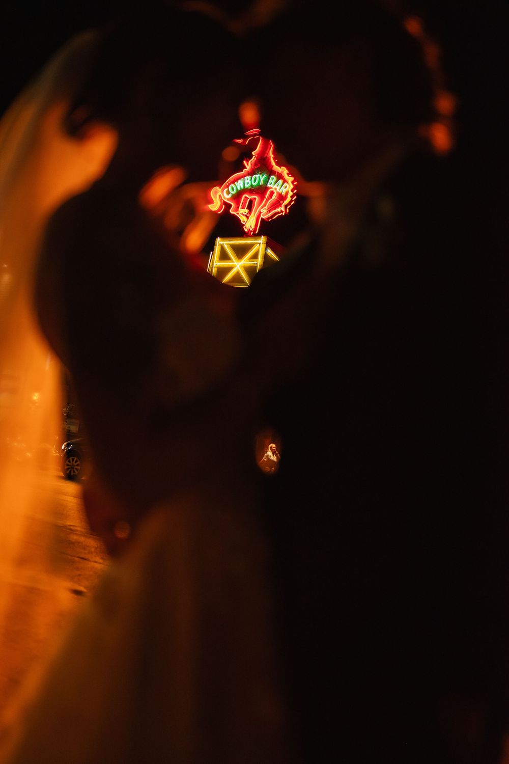 Illuminated star-shaped lights create a warm glow against a dark night sky.