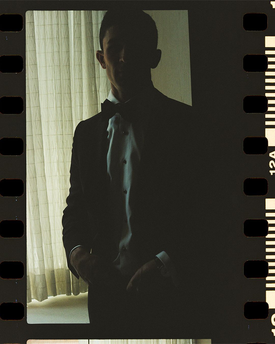 Dark and moody film strip capturing silhouettes in an indoor setting.