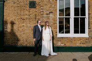 A series of wedding photos showing couples in formal attire against a rustic brick building with white window frames.