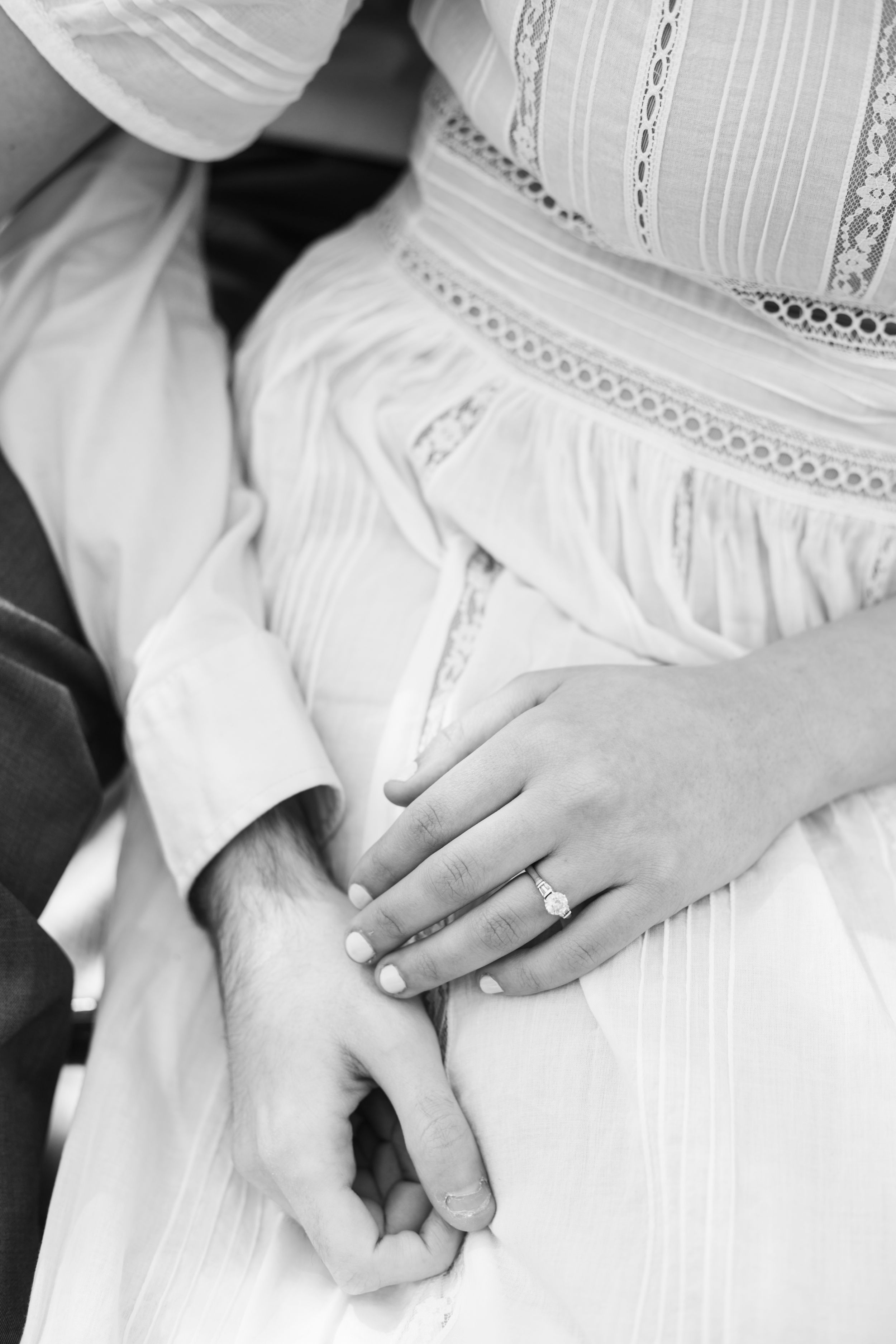 Close-up series of hands clasped together on white fabric showing different angles and positions.