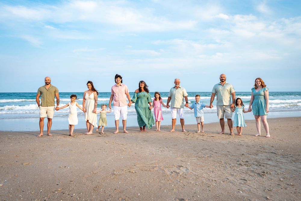 A sequence of photos showing a group of people walking along a sandy beach at sunset in matching outfits.