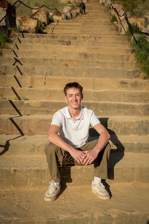 Senior Pictures guy sitting on steps milestones portraits