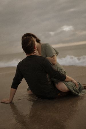 An intimate couples session in the water in Cocoa Beach, Florida at sunrise.