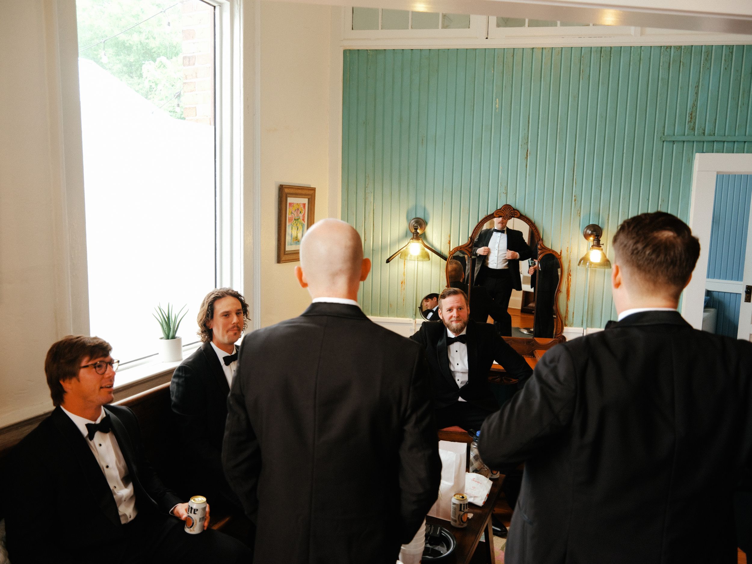 A series of formal business meetings shown in four connected photos with people gathered in office settings.