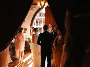 Silhouettes of wedding guests during an evening celebration.