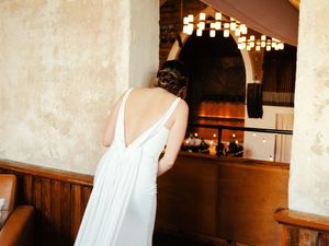 Wedding venue interior with warm lighting and elegant white decor elements.