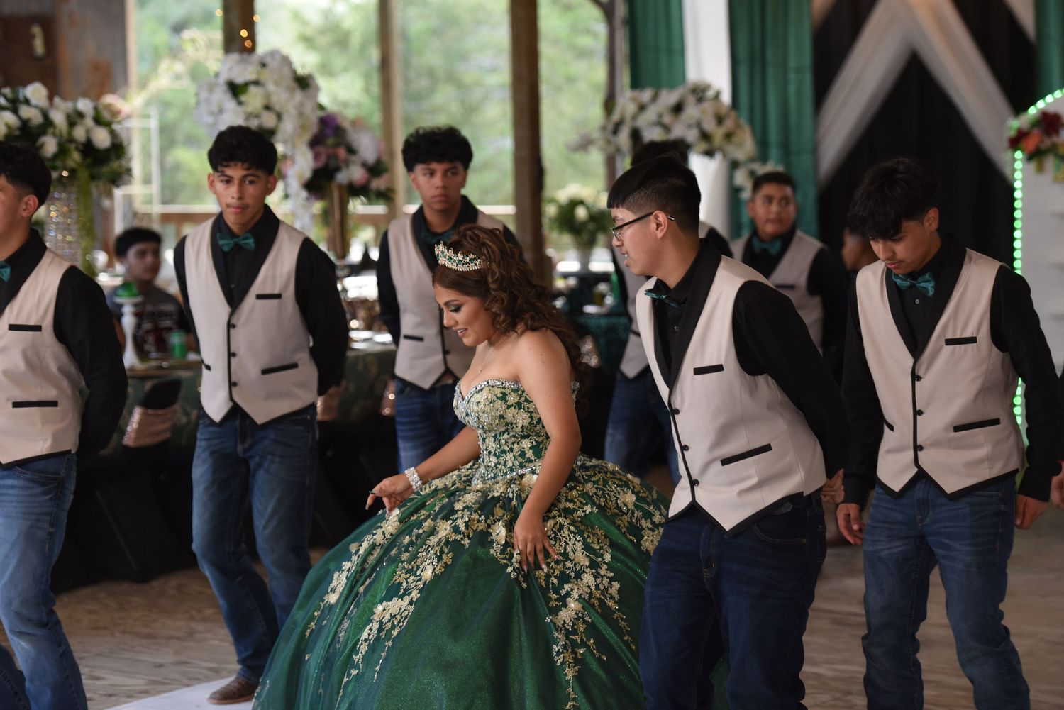 Quinceañera practicing choreography at home using online dance lessons, a cost-saving and stress-free quince trend