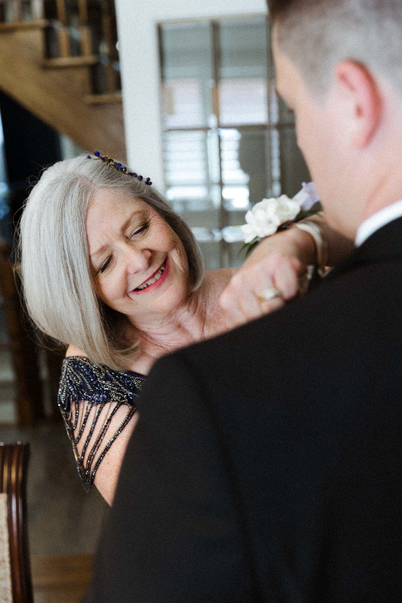 Elderly couple dancing together in formal attire, sharing a joyful moment on the dance floor.