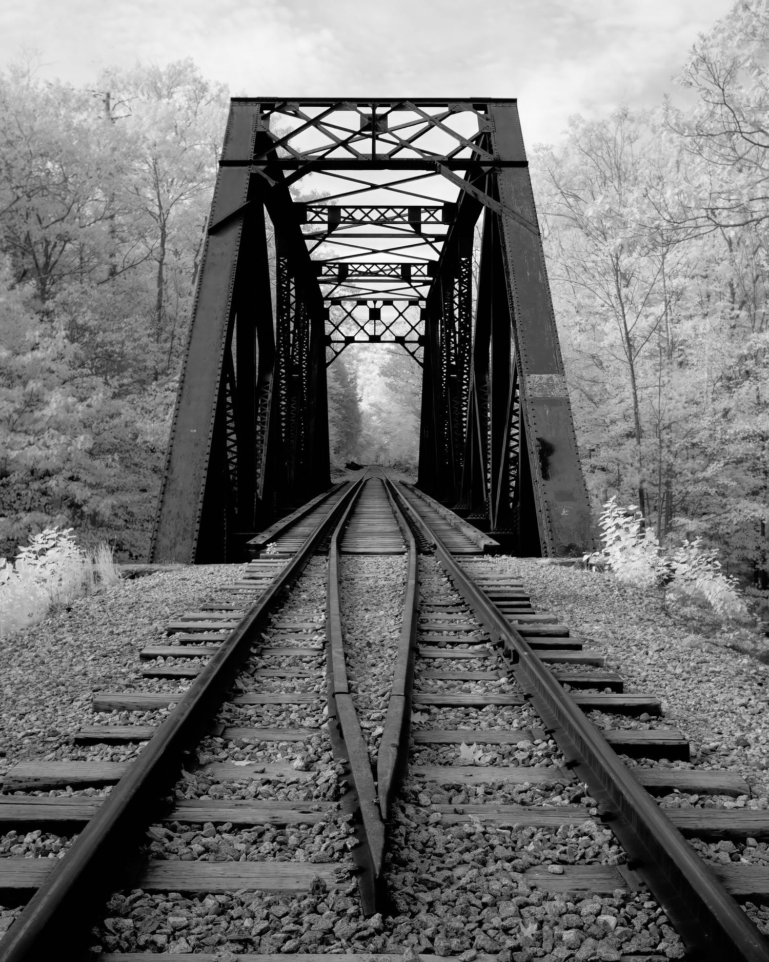 David G Holt Photography - Black and white panoramic series of an abandoned railroad bridge with converging lines.