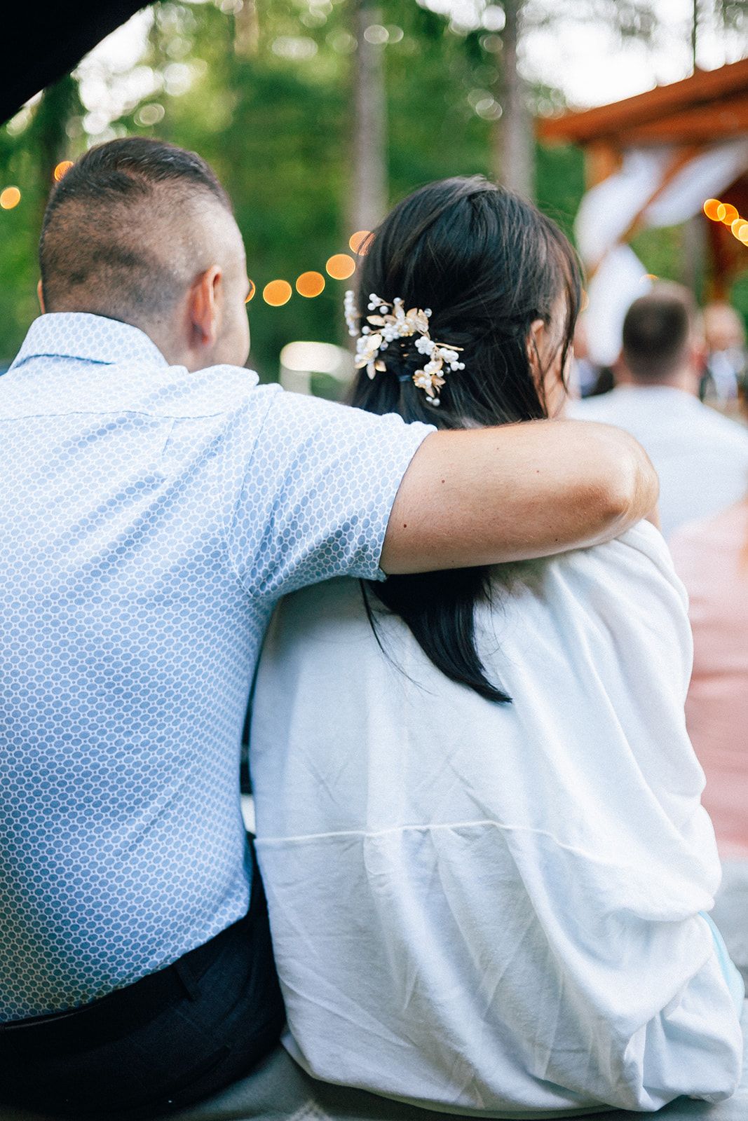 A sequence of images showing people in white and blue attire embracing at what appears to be an outdoor celebration.