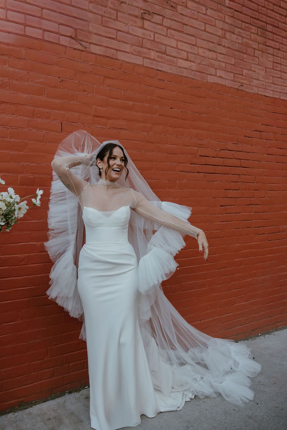 Anti-bride style with ruffled veil downtown Toronto. Howdy Pictures - film wedding & elopement photographers in Canada & New Zealand