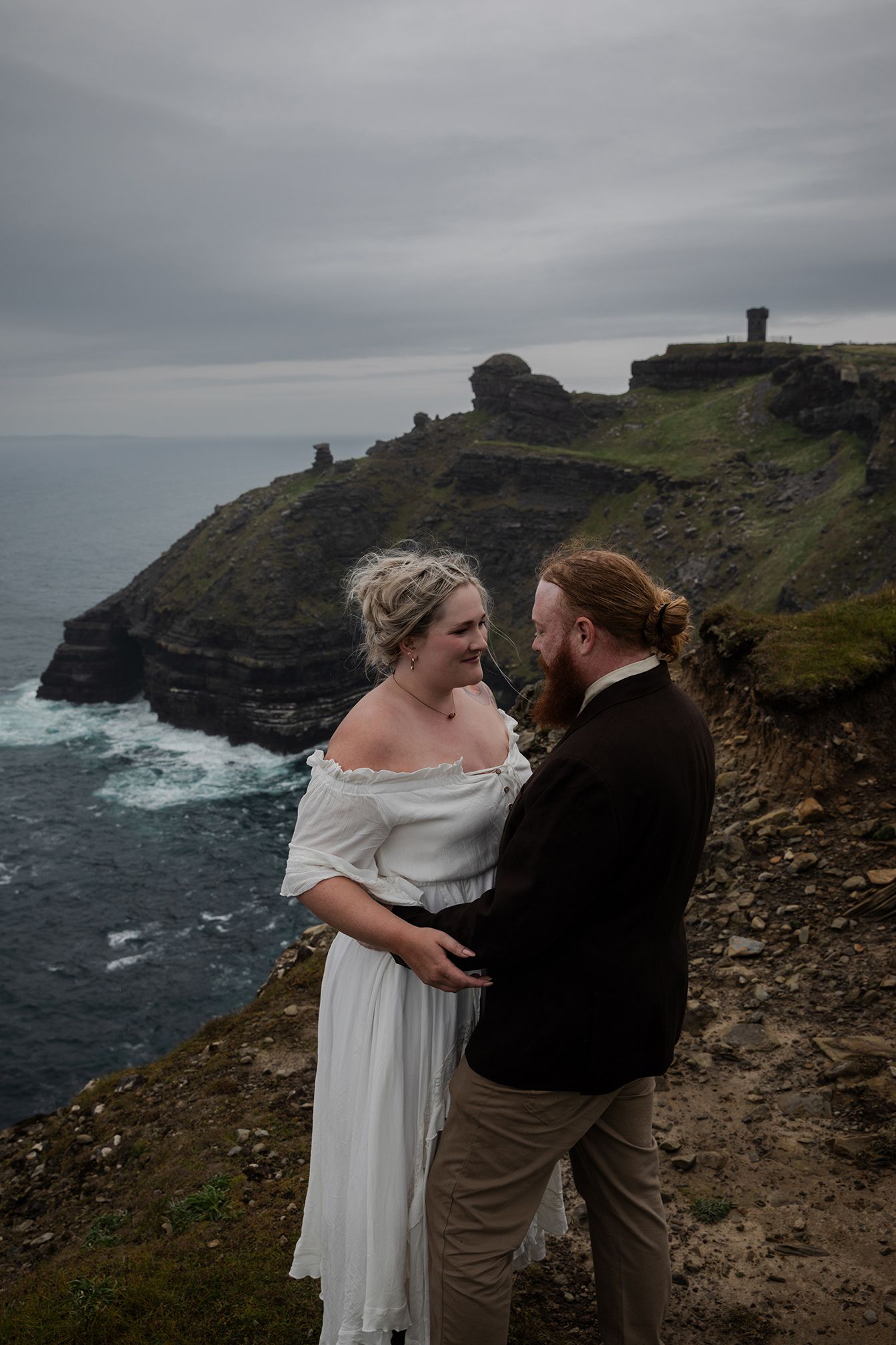 Intimate rainy elopement portraits along the Wild Atlantic Way at Hags Head