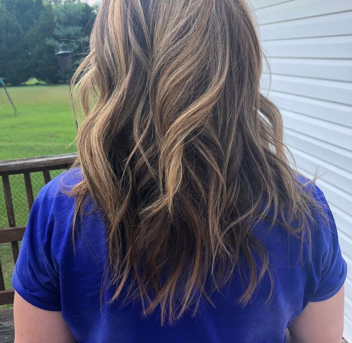 Series of photos showing wavy brown hair with highlights styled in a layered cut from different angles.