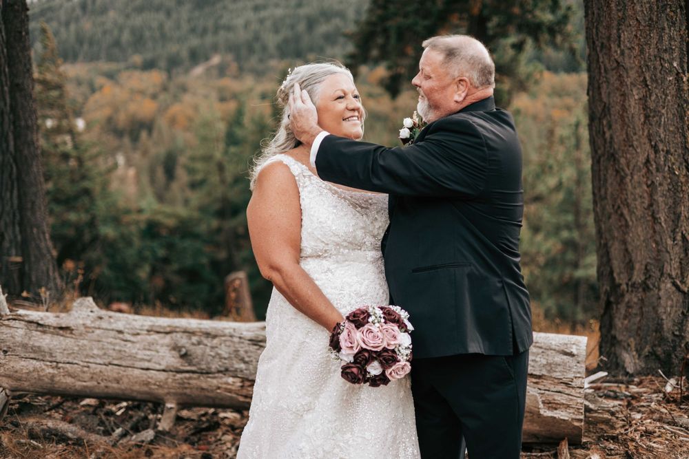 Suncadia, WA wedding couple, man and woman looking at each other with Mountain View in background.