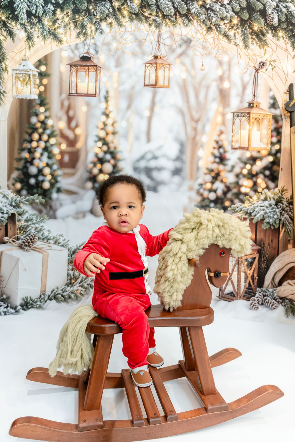 A series of photos showing a small child in red velvet outfit playing on a wooden rocking horse with winter decor.