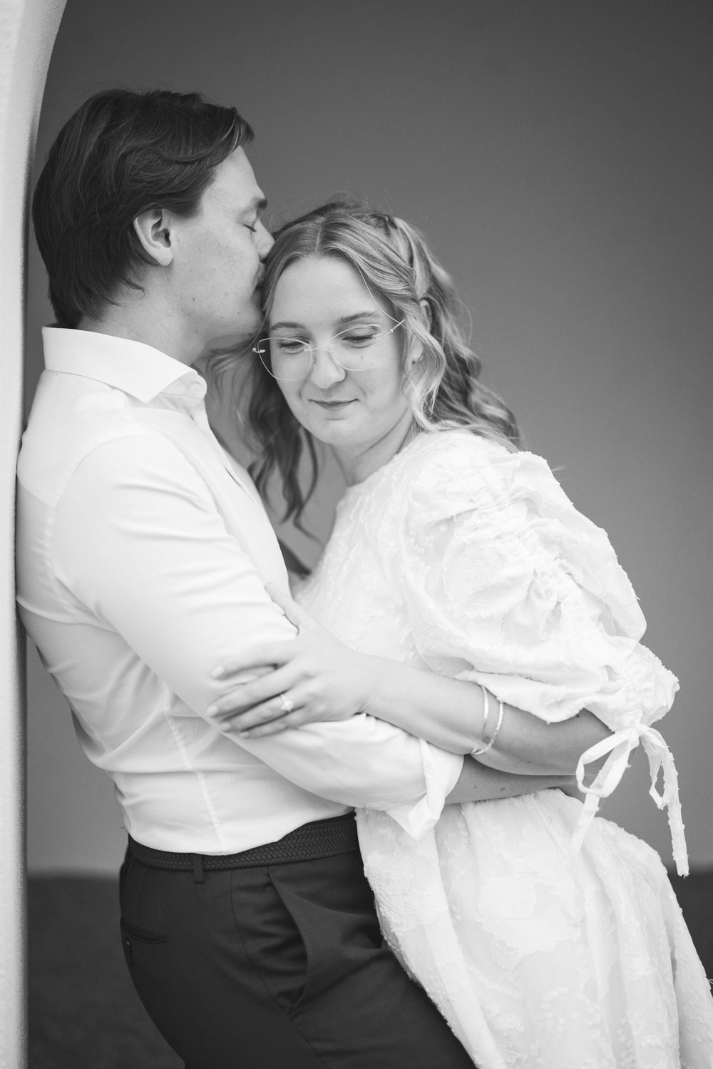 A romantic black and white dance sequence shows a couple in formal attire embracing in multiple tender poses.