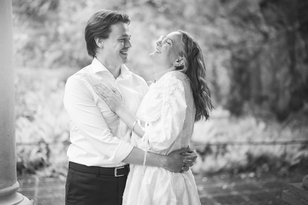 A romantic black and white photo series showing a couple dancing together in an outdoor setting.