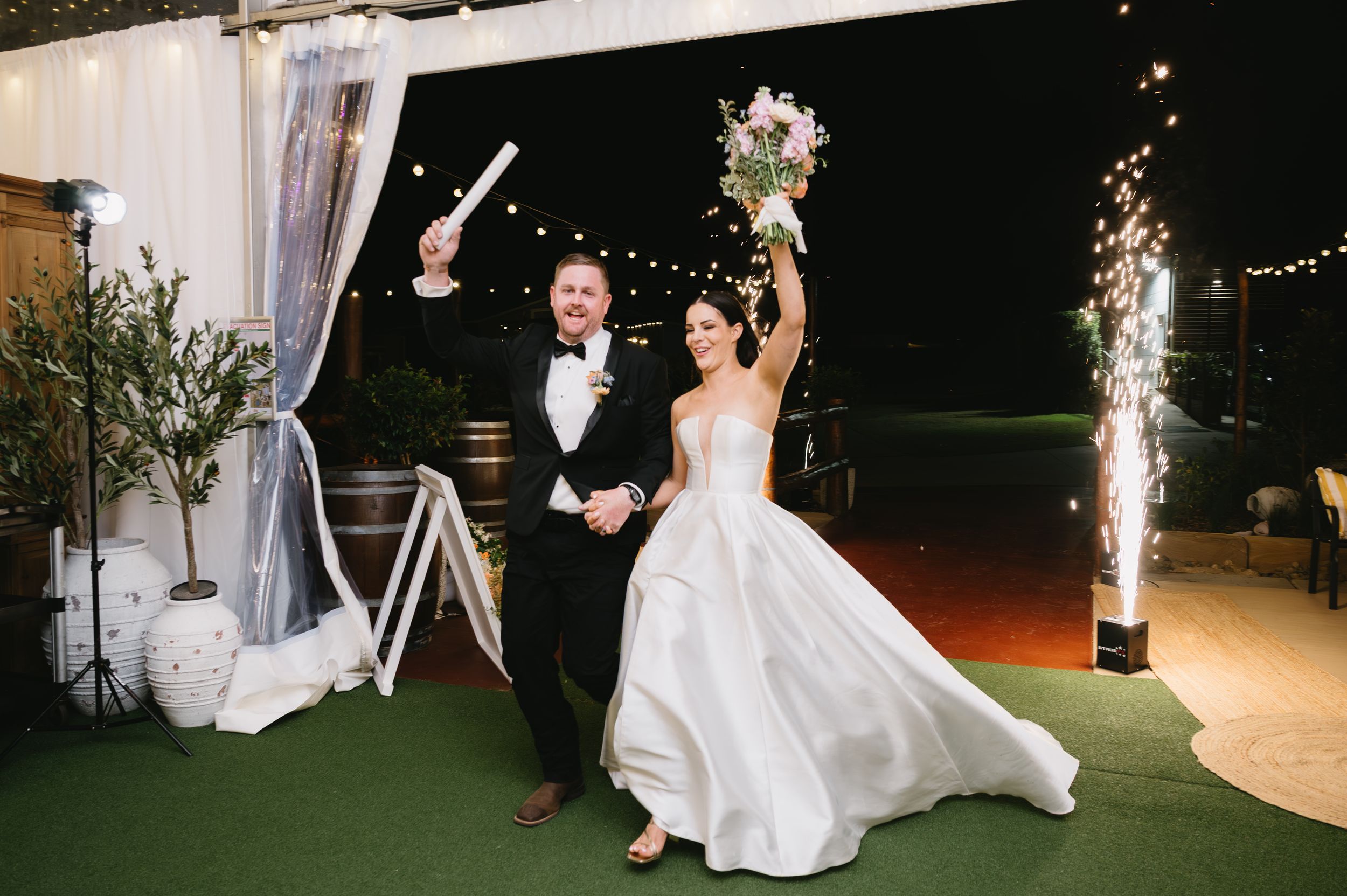 A romantic wedding dance sequence showing couples twirling and celebrating on an elegantly lit dance floor.