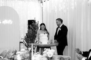 Black and white wedding photos arranged in a collage showing reception moments and dancing at an elegant venue.