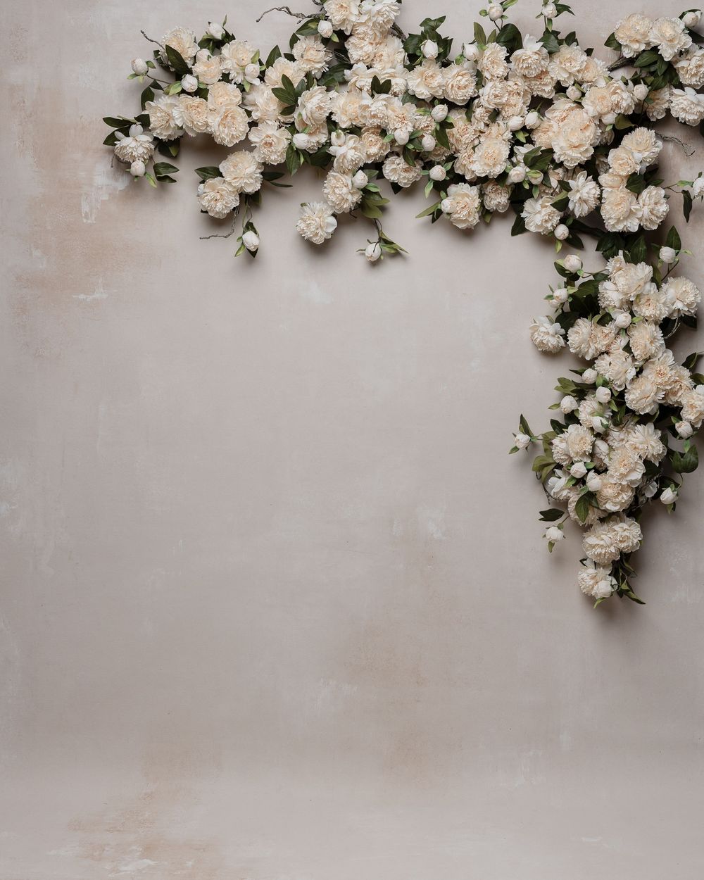 White roses and delicate blooms create a romantic border against a light gray textured background.