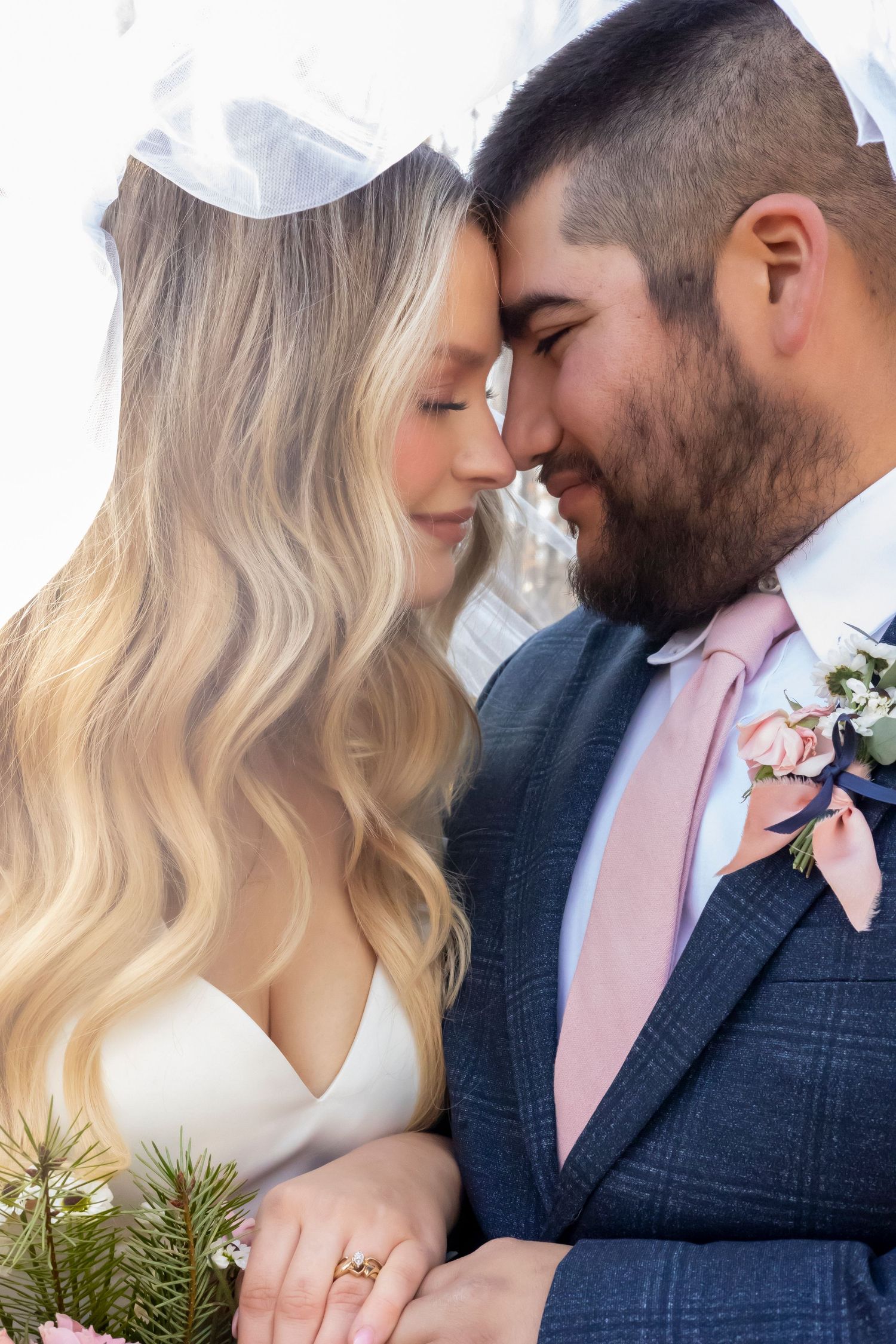 Closeup image of bride and groom under the veil. Boise wedding photographer.