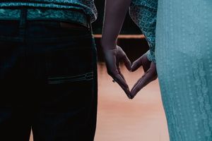 couples hands resembling a heart shape