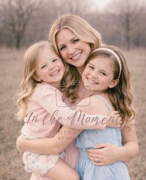 Outdoor mommy and me session with mom and two girls smiling