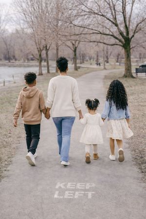 Family walking away together showing connection and candid moment in park setting