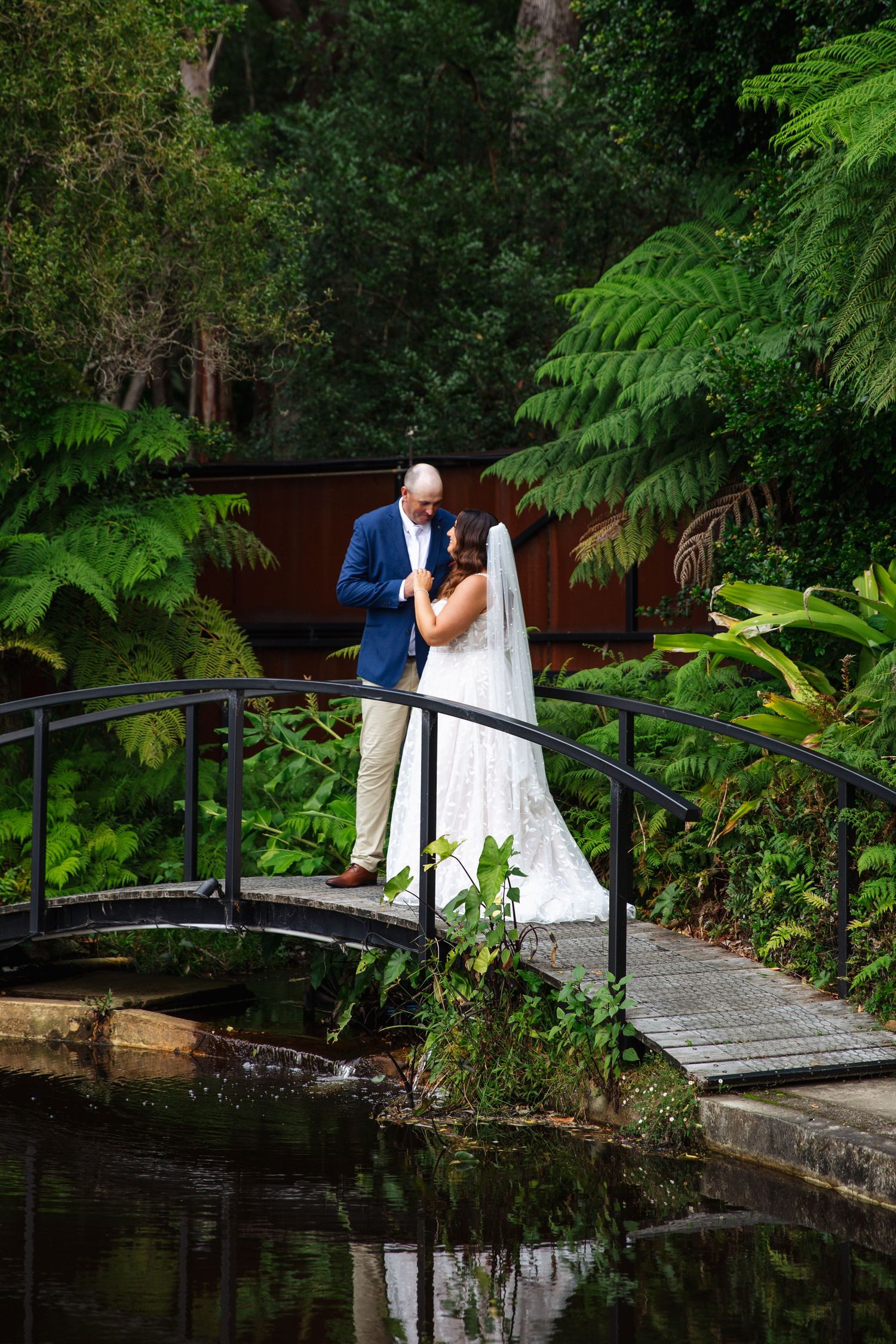 Newlyweds walking down the aisle with confetti falling