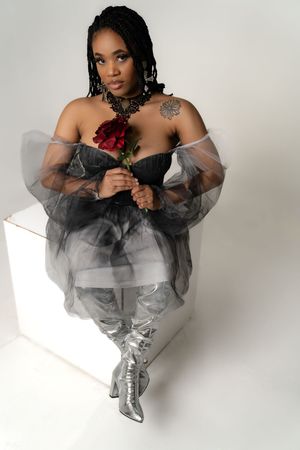 Charleston editorial women’s portrait in black tulle dress holding red rose