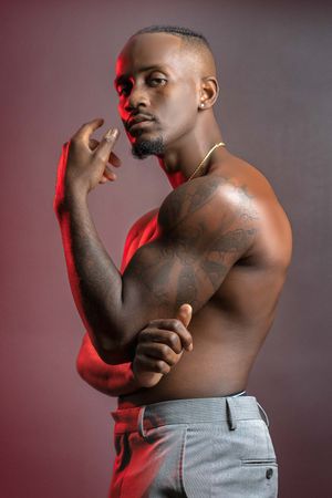 Charleston dramatic lighting men’s portrait with red accent light and studio backdrop