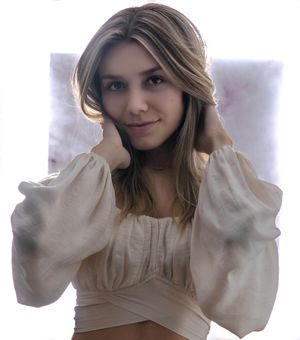 Charleston studio portrait of woman with soft natural styling and bright backlight backdrop