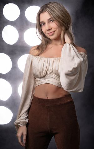 Charleston fashion studio portrait of woman in cream blouse with professional studio lighting setup