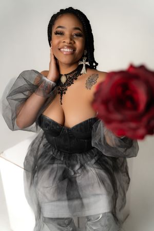 Charleston creative beauty portrait with red rose and black sheer styling