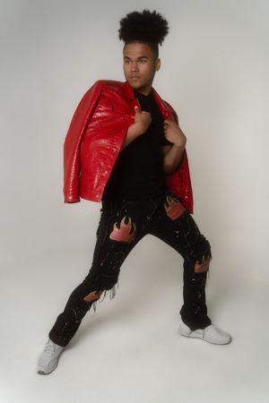 Charleston full body men’s studio portrait in red leather jacket on white backdrop