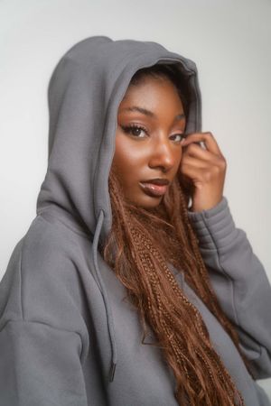 Charleston beauty portrait of woman in grey hoodie with soft studio lighting
