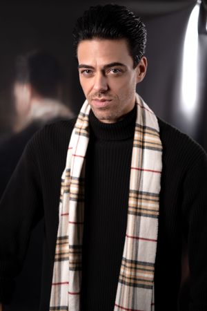 Summerville SC modern men’s fashion portrait in black sweater with patterned scarf