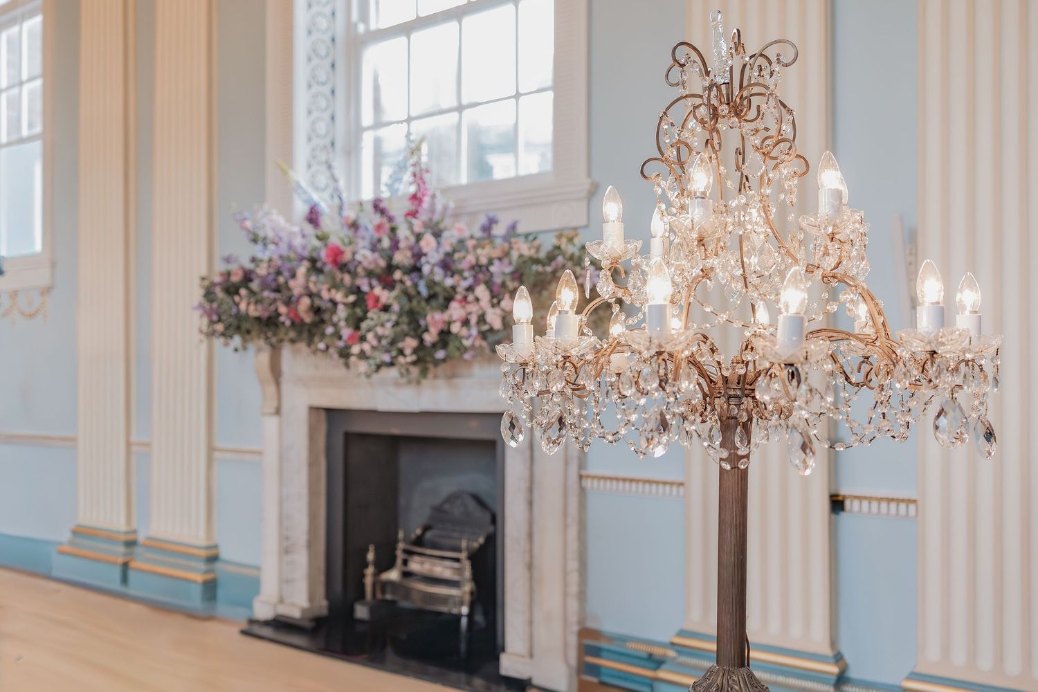 Behind the scenes of a Bridgerton Netflix filming setup at Newark Town Hall, showing the ballroom fireplace area after photoshop.
