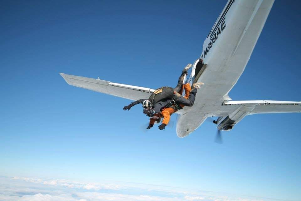 Sequence showing an airplane performing aerial stunts against a bright blue sky.