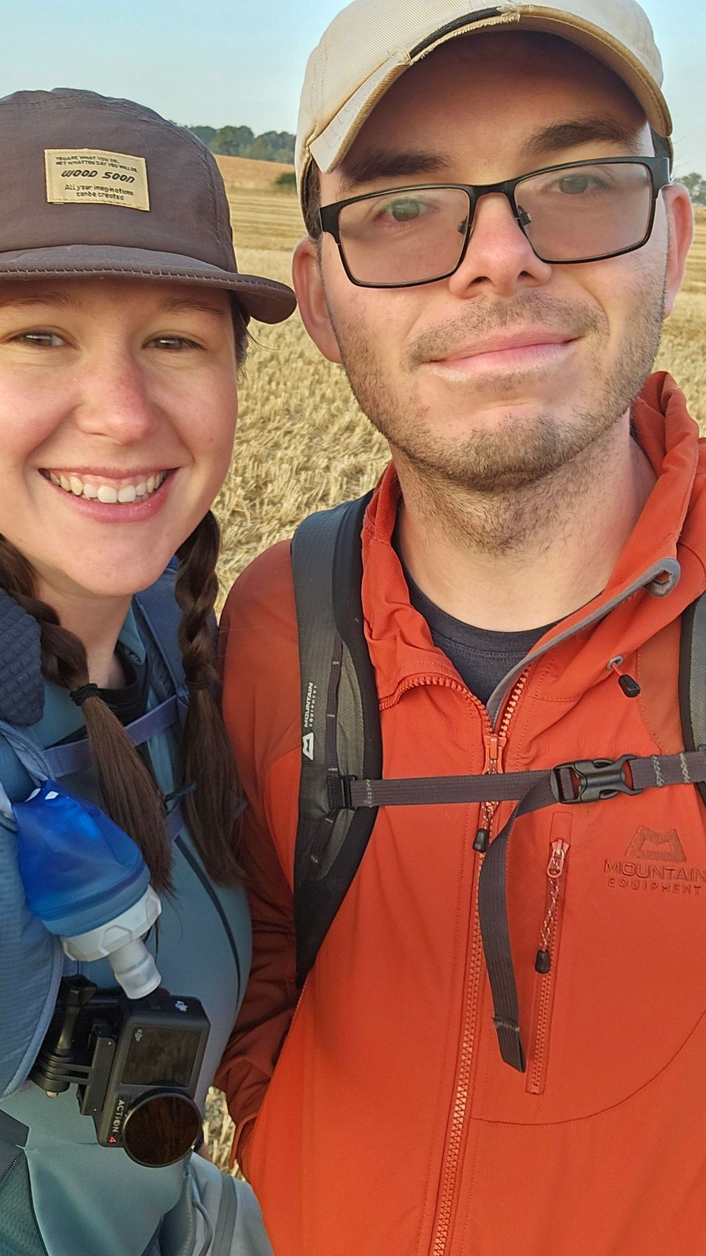 Outdoor hiking selfies showing two people wearing baseball caps and outdoor gear.