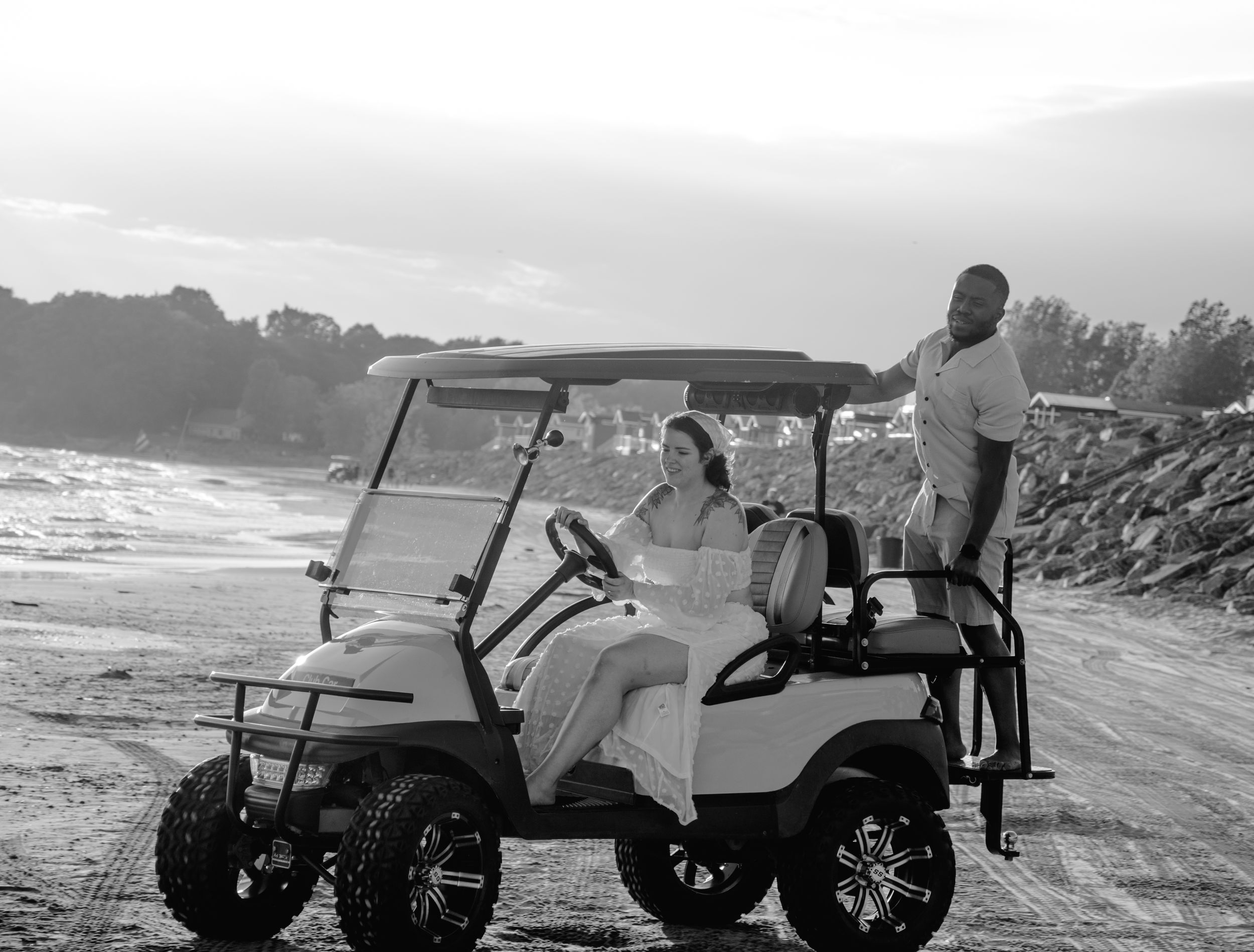 Beach adventure in vintage-style golf carts along the shoreline.